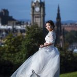 Asian girl in wedding dress on Calton Hill in Edinburgh